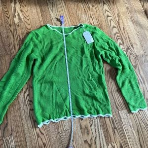 Green cozy sweater with white trim size small